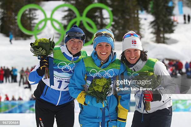 Kristina Smigun-Vaehi of Estonia wins the silver medal, Charlotte Kalla of Sweden wins the gold medal and Marit Bjoergen of Norway wins the bronze...