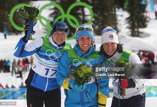 Kristina Smigun-Vaehi of Estonia wins the silver medal, Charlotte Kalla of Sweden wins the gold medal and Marit Bjoergen of Norway wins the bronze...