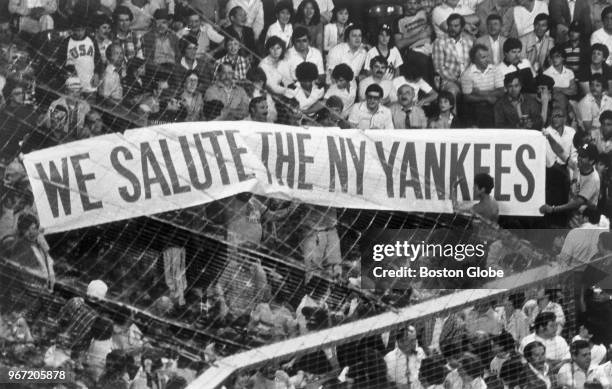 Fans hold a banner reading "We Salute The NY Yankees" in the stands at Fenway Park in Boston on July 2, 1980.