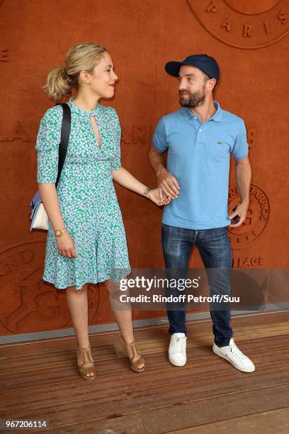 Alysson Paradis and actor Guillaume Gouix attend the 2018 French Open - Day Nine at Roland Garros on June 4, 2018 in Paris, France.