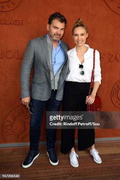 Actors Clovis Cornillac and his wife Lilou Fogli attend the 2018 French Open - Day Nine at Roland Garros on June 4, 2018 in Paris, France.