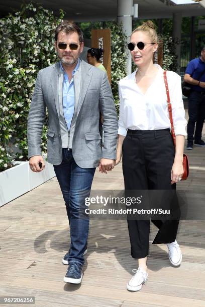 Actors Clovis Cornillac and his wife Lilou Fogli attend the 2018 French Open - Day Nine at Roland Garros on June 4, 2018 in Paris, France.