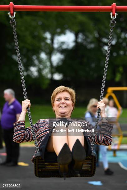 First Minister Nicola Sturgeon sits on a swing as she officially opens Play as One Scotland's fully inclusive play park on June 4, 2018 in...