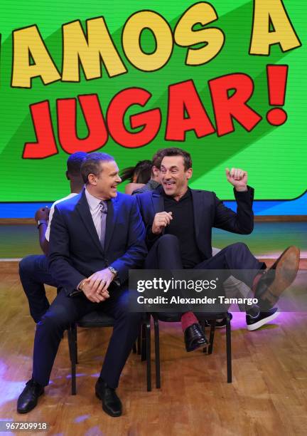 Alan Tacher and Jon Hamm are seen playing musical chairs on the set of "Despierta America" at Univision Studios to promote the film "TAG" on June 4,...