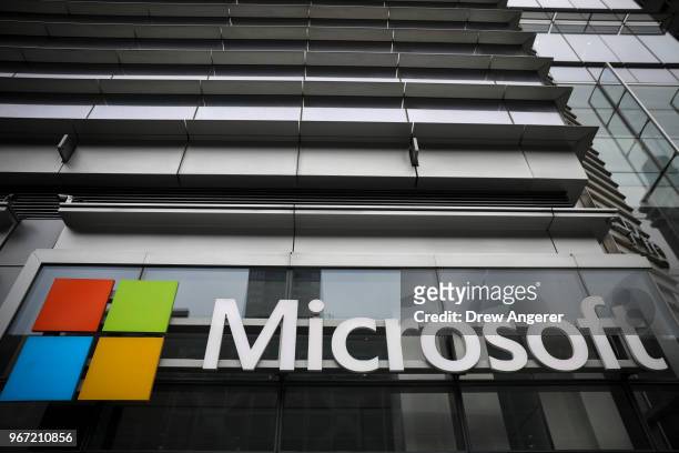 The Microsoft logo is displayed outside the Microsoft Technology Center near Times Square, June 4, 2018 in New York City. Microsoft officially...