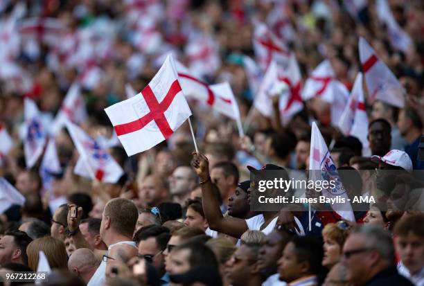 England supporters wave flags during the International Friendly between England and Nigeria at Wembley Stadium on June 2, 2018 in London, England.