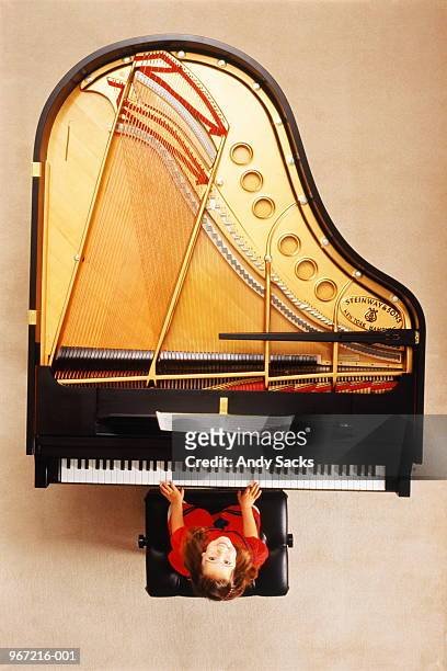girl(4-5) playing steinway grand piano, smiling, overhead view - grand piano 個照片及圖片檔