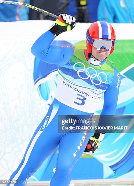 France's David Poisson celebrates in the finish area during the Men's Vancouver 2010 Winter Olympics Downhill event at Whistler Creek side Alpine...