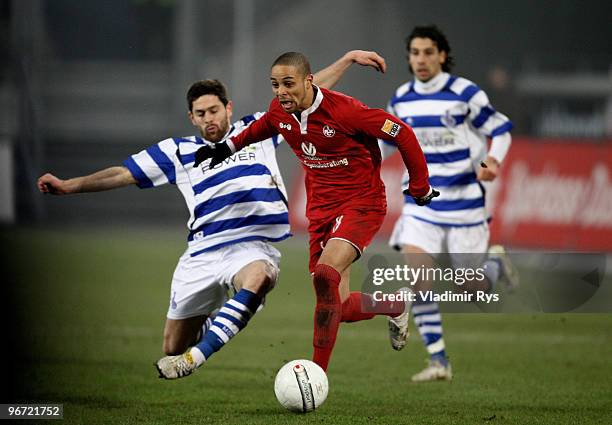 Sidney Sam of Kaiserslautern attacks defended by Olivier Veigneau of Duisburg during the Second Bundesliga match between MSV Duisburg and 1. FC...