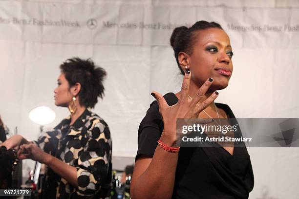 TRESemme celebrity stylist Jeanie Syfu and designer Tracy Reese prepare models backstage during the Tracy Reese Fall 2010 Fashion Show presented by...