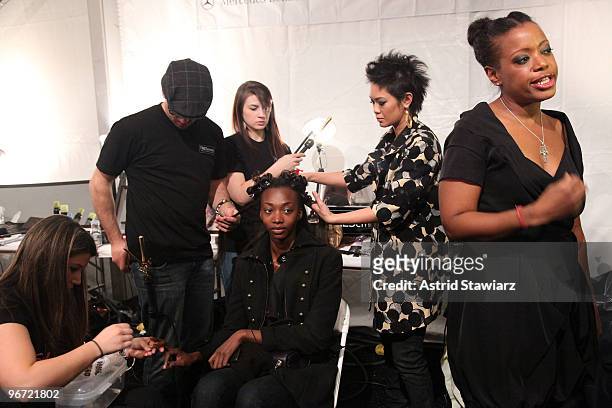 TRESemme celebrity stylist Jeanie Syfu and designer Tracy Reese prepare models backstage during the Tracy Reese Fall 2010 Fashion Show presented by...