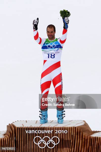 Didier Defago of Switzerland celebrates after taking gold in the Alpine skiing Men's Downhill at Whistler Creekside during the Vancouver 2010 Winter...