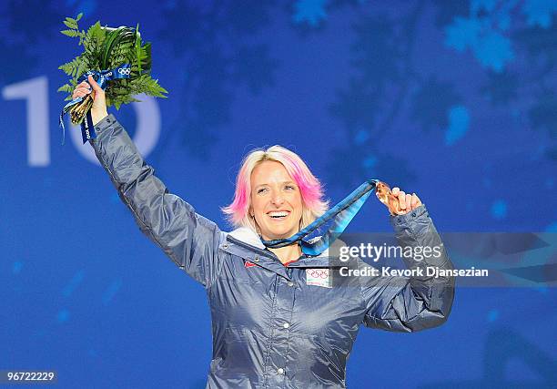 Shannon Bahrke of United States celebrates winning her bronze medal during the medal ceremony for the Ladies Moguls final Medal ceremony on day 3 of...