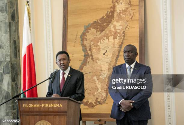 Mdagascar's President Hery Rajaonarimampianina delivers a speech, next to outgoing Madagascar's Prime Minister Olivier Mahafaly , during a press...