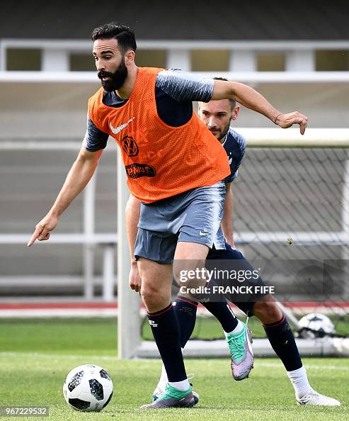 Adil Rami Fra France's defender Adil Rami vies with France's goalkeeper Hugo Lloris ...