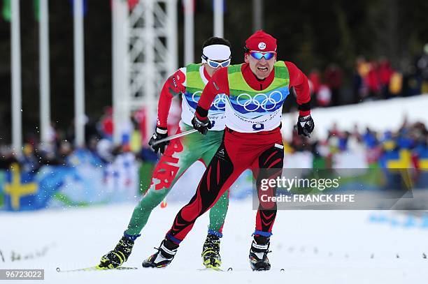 Slovakia's Martin Bajcicak and Bulgaria's Dolidovich compete during the men's Cross-Country Skiing 15km free at Whistler Olympic Park on February 15,...