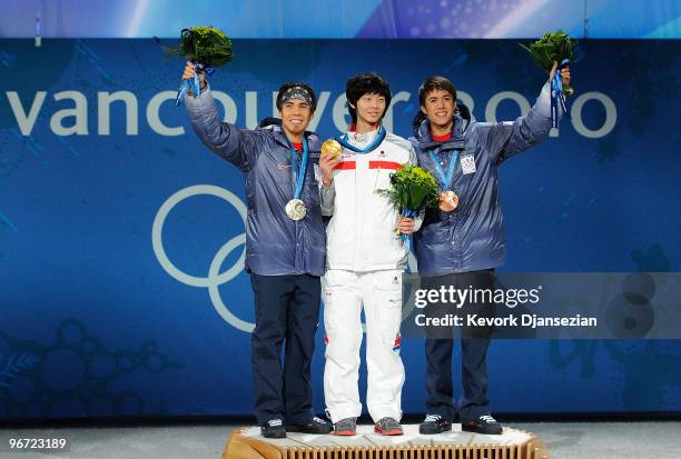 Apolo Anton Ohno of United States , Jung-Su Lee of South Korea and J.R. Celski of United States celebrate during the medal ceremony for the Men�s...