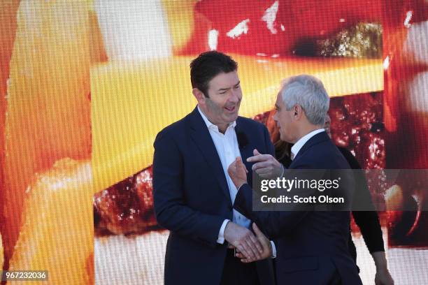 McDonald's CEO Steve Easterbrook chats with Chicago Mayor Rahm Emanuel at the unveiling of the company's new corporate headquarters on June 4, 2018...
