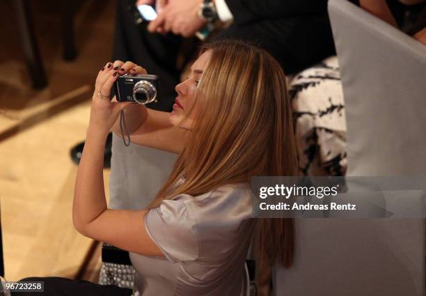 Model Bar Refaeli takes a photograph as she attends the Annual Cinema For Peace Gala during day five of the 60th Berlin International Film Festival...