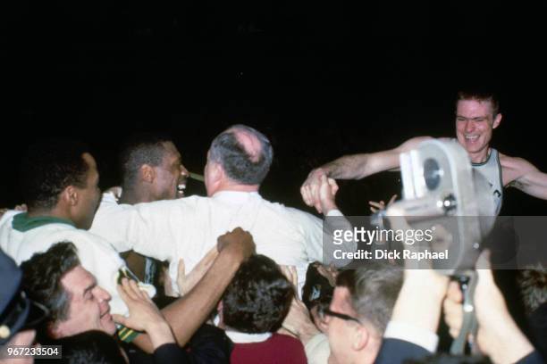 Bill Russell and Head Coach Red Auerbach of the Boston Celtics celebrate circa 1968 at the Boston Garden in Boston, Massachusetts. NOTE TO USER: User...