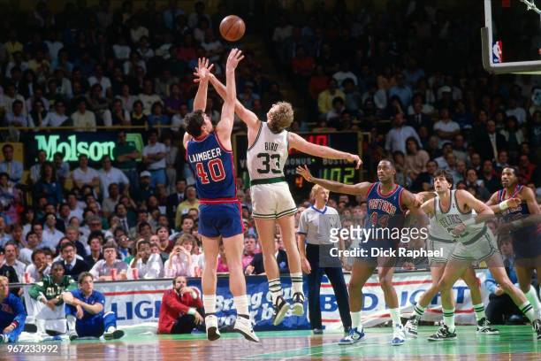 Larry Bird of the Boston Celtics contests the shot by Bill Laimbeer of the Detroit Pistons circa 1988 at the Boston Garden in Boston, Massachusetts....