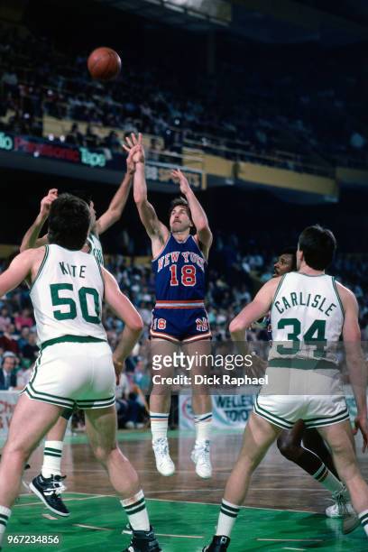 Ernie Grunfeld of the New York Knicks shoots the ball against the Boston Celtics circa 1986 at the Boston Garden in Boston, Massachusetts. NOTE TO...