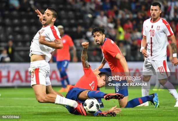 Serbia's Aleksandar Mitrovic is fouled by Chile's Erick Pulgar during the international friendly football match Serbia v Chile at the Merkur Arena in...