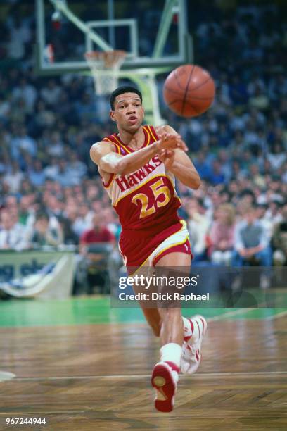 Doc Rivers of the Atlanta Hawks passes the ball against the Boston Celtics circa 1988 at the Boston Garden in Boston, Massachusetts. NOTE TO USER:...