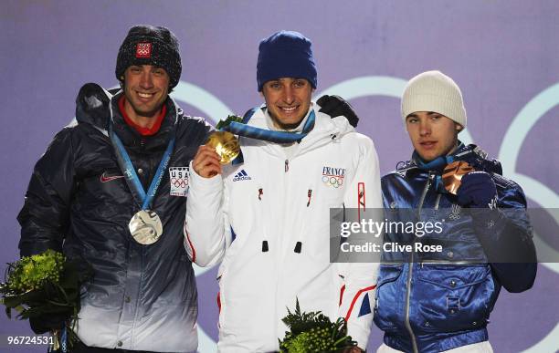 Johnny Spillane of United States, Jason Lamy Chappuis of France and Alessandro Pittin of Italy pose with their medals during the Medal ceremony for...