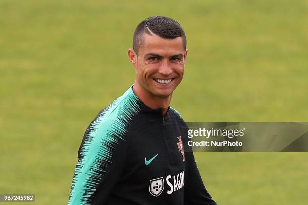 Portugal's forward Cristiano Ronaldo gestures during a training session at Cidade do Futebol training camp in Oeiras, outskirts of Lisbon, on June 4...