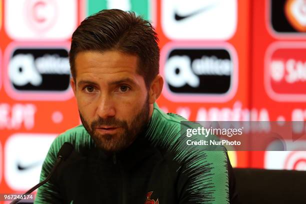 Portugal's midfielder Joao Moutinho attends a press conference before a training session at Cidade do Futebol training camp in Oeiras, outskirts of...