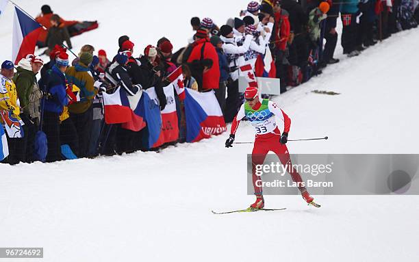 Dario Cologna of Switzerland competes during the Cross-Country Skiing Men's 15 km Free on day 4 of the 2010 Winter Olympics at Whistler Olympic Park...