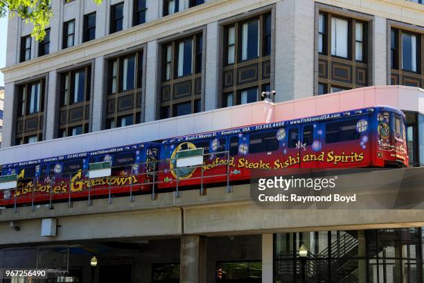 The Detroit People Mover makes its way through downtown in Detroit, Michigan on May 25, 2018.