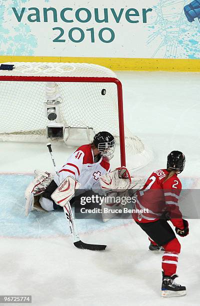 Meghan Agosta of Canada scores past goalkeeper Florence Schelling of Switzerland during the Women's preliminary game between Switzerland and Canada...