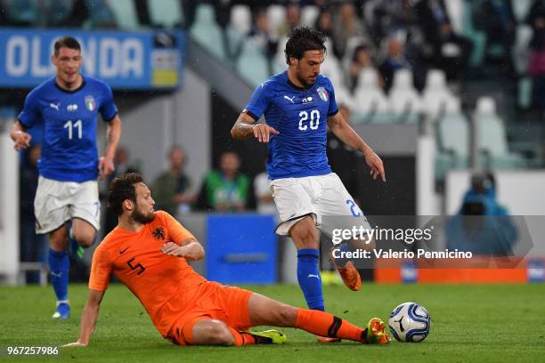 Simone Verdi of Italy competes for the ball with Daley Blind of Netherlands during the International Friendly match between Italy and Netherlands at...