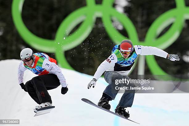 Mike Robertson of Canada and Seth Wescott of the United States compete against each other in the big final heat during the Men's SBX Finals on day 4...