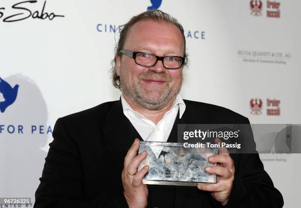 Director Stefan Arndt poses with his award during the Annual Cinema For Peace Gala during day five of the 60th Berlin International Film Festival at...