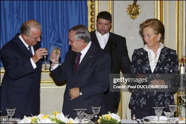 On the second day of Belgium royal couple state visit to France, Belgium's King Albert II and Queen Paola toast with French Prime minister...