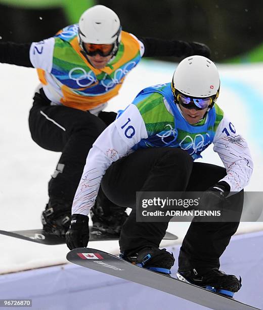 Robert Fagan of Canada and Lukas Gruener of Austria compete in the Men's Snowboard SBX finals at Cypress Mountain during the Vancouver Winter...