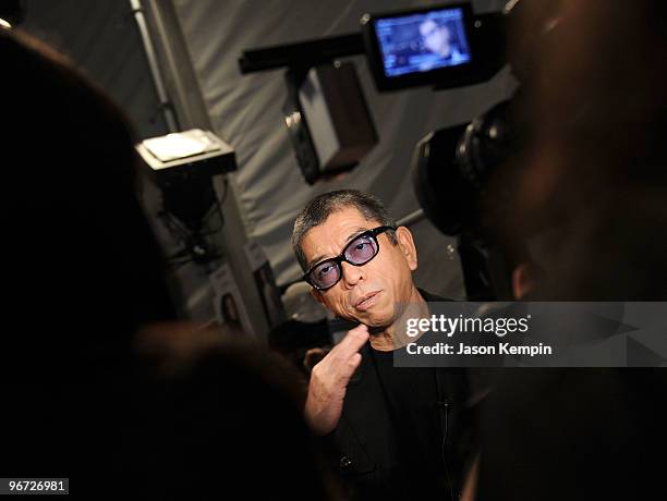 Designer Tadashi Shoji speaks backstage at the Tadashi Shoji Fall 2010 Fashion Show during Mercedes-Benz Fashion Week at the Salon at Bryant Park on...
