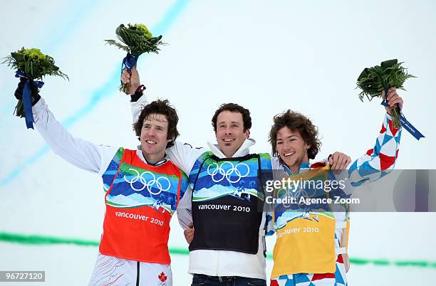 Seth Wescott of the USA takes 1st place, Mike Robertson of Canada takes 2nd place,Tony Ramoin of France takes 3rd place during the Men's Snowboard...