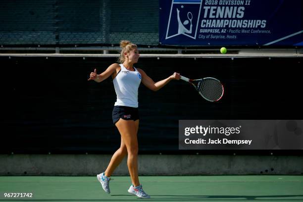 Sonja Larsen of Barry University returns a ball against the University of West Florida during the Division II Women's Tennis Championship held at the...