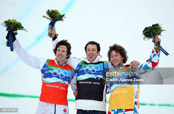 Seth Wescott of the USA takes 1st place, Mike Robertson of Canada takes 2nd place,Tony Ramoin of France takes 3rd place during the Men's Snowboard...