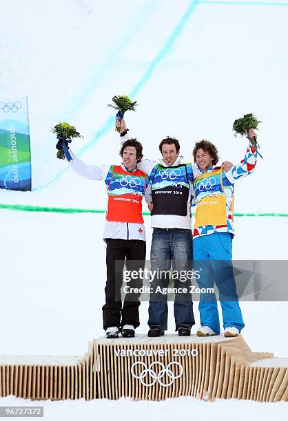 Seth Wescott of the USA takes 1st place, Mike Robertson of Canada takes 2nd place,Tony Ramoin of France takes 3rd place during the Men's Snowboard...