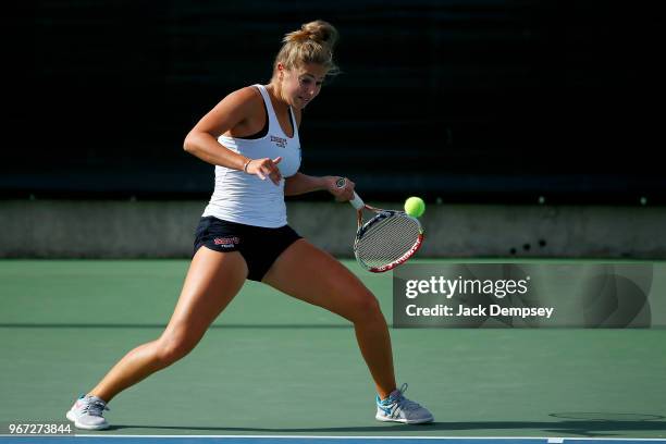 Sonja Larsen of Barry University returns a ball against the University of West Florida during the Division II Women's Tennis Championship held at the...