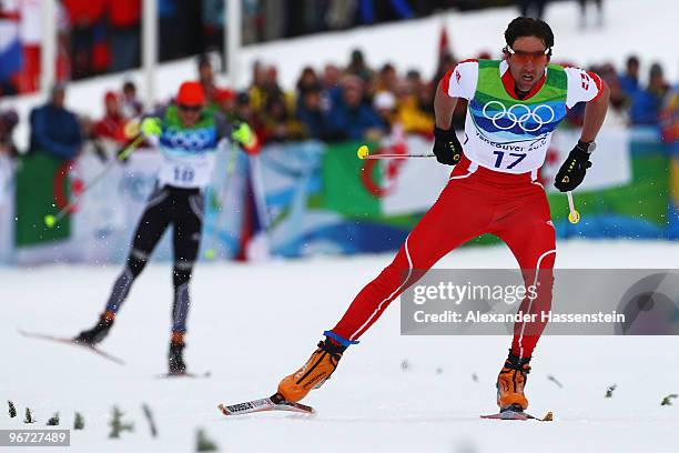 Curdin Perl of Switzerland competes during the Cross-Country Skiing Men's 15 km Free on day 4 of the 2010 Winter Olympics at Whistler Olympic Park...