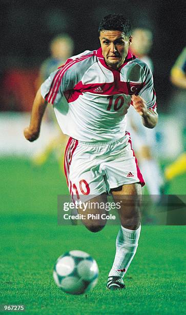 Yildiray Basturk of Turkey runs with the ball during the FIFA 2002 World Cup Qualifier against Sweden played at the Ali Sami Yen Stadium in Istanbul,...