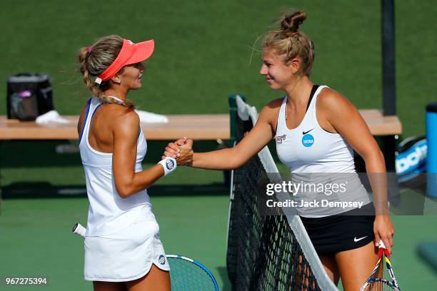 Sonja Larsen of Barry University shakes hands with Paula Coyos of the University of West Florida during the Division II Women's Tennis Championship...