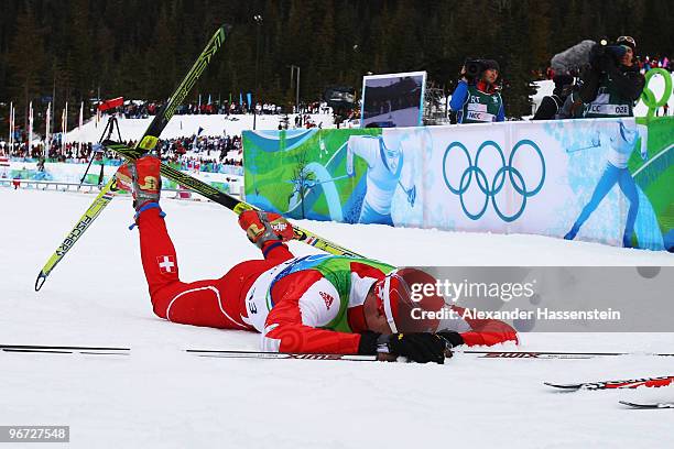 Dario Cologna of Switzerland crosses the line to take eventual gold during the Cross-Country Skiing Men's 15 km Free on day 4 of the 2010 Winter...