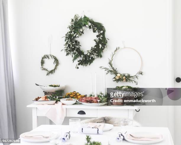 christmas dinner on a sideboard in a dining room - christmas minimal stockfoto's en -beelden